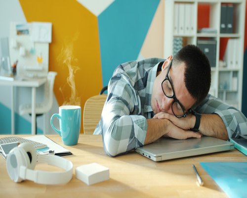 Person experiencing fatigue at work